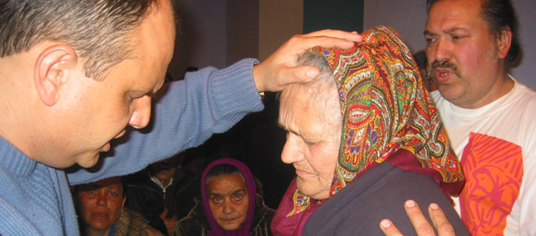 Pastor Brugosh laying on of hands